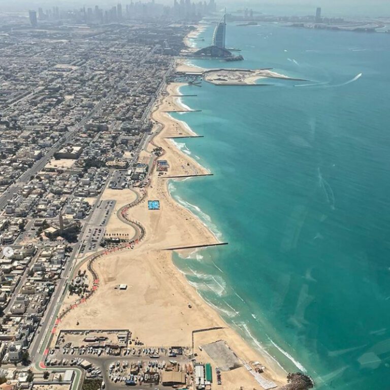 Aerial view of Jumeirah beach, an artificial stretch of coastline from helicopter view of Dubai.